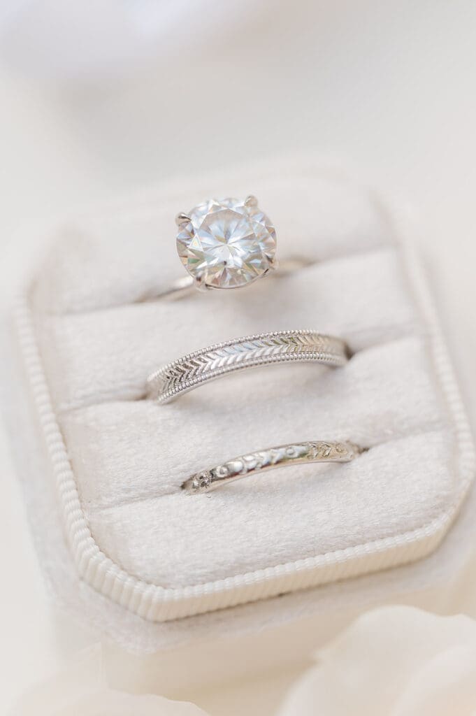 Three wedding rings in a ring box for a wedding flat lay. 