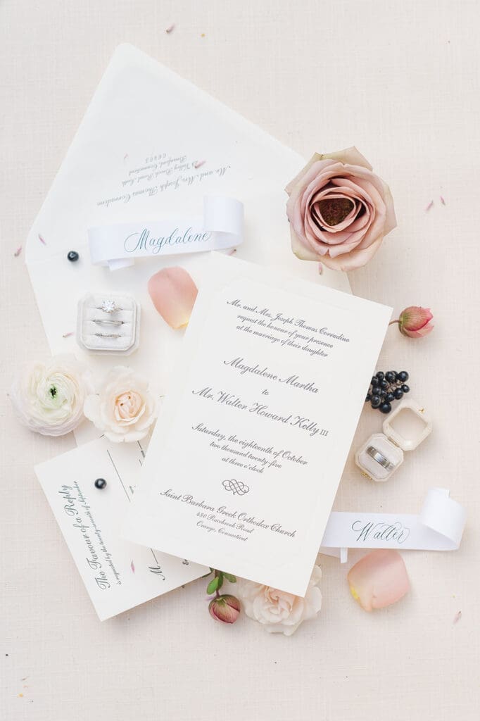 A wedding flat lay of an invitation suite for Magdalene and Trey 