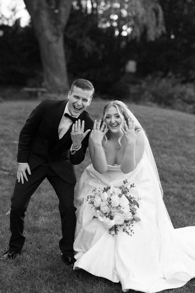 Trey and Magdalene hold their hands up in celebration 