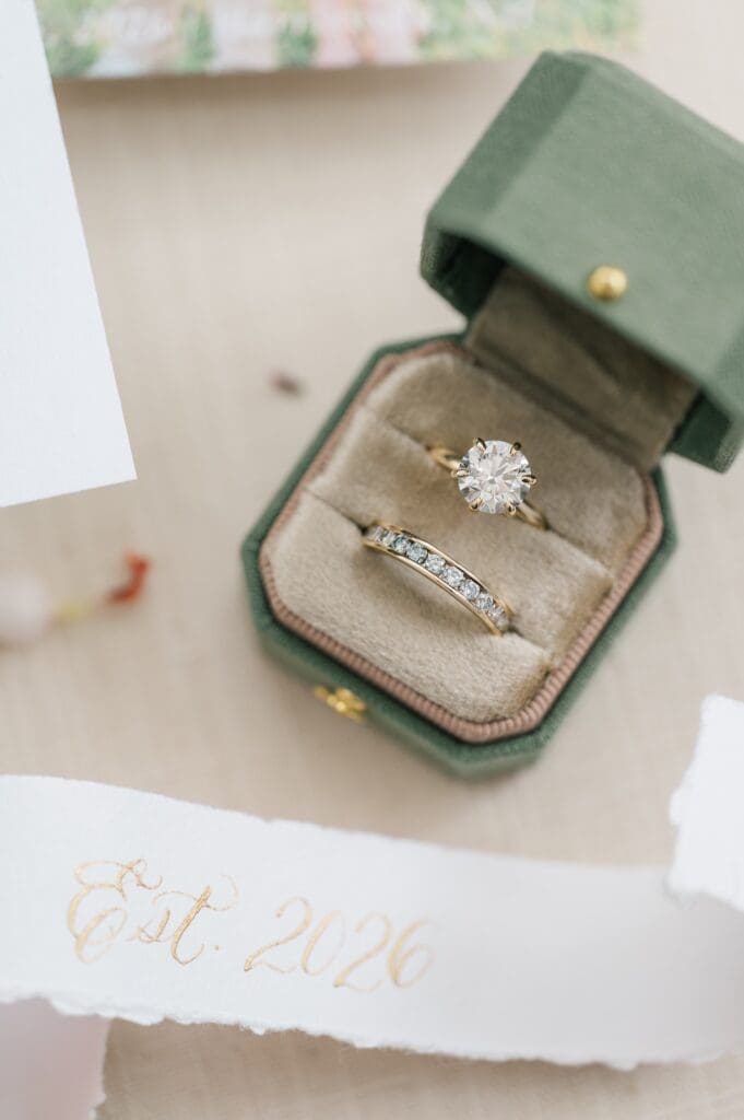 A macro photo of a classic round ring and diamond band. 