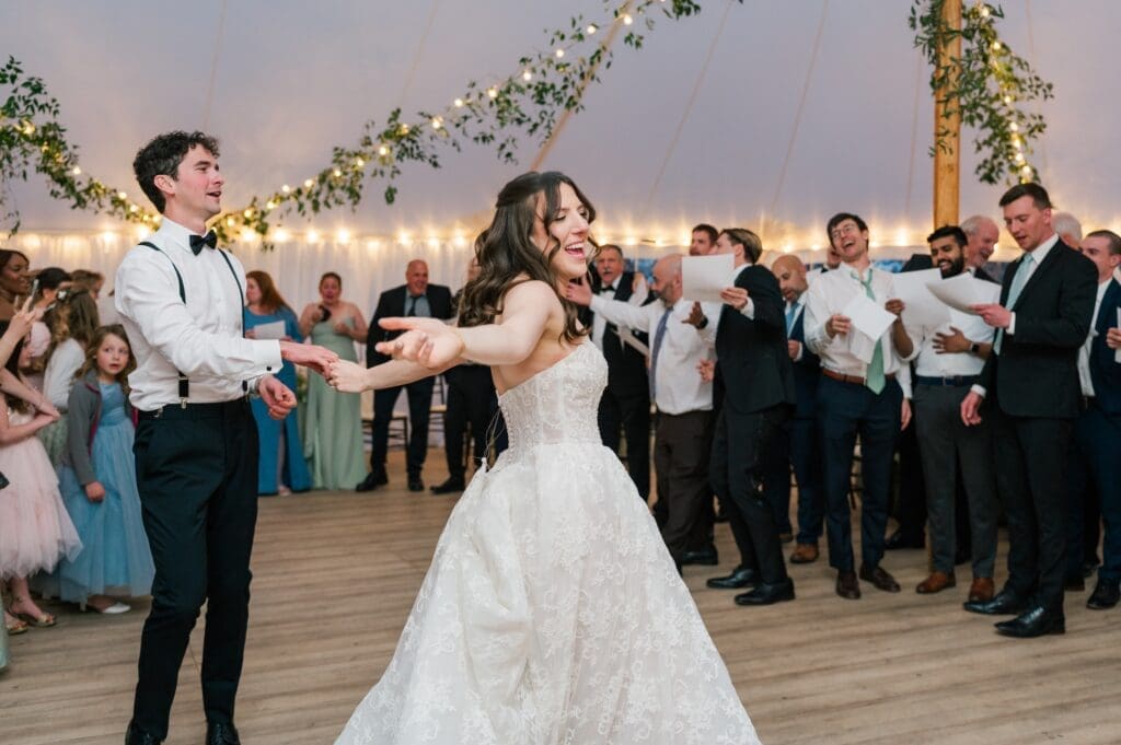 Miranda and Mitch dancing to "That's Amore" while everyone around them sings. 