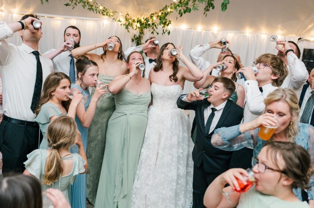 All the wedding guests chugging beer on the dance floor. 