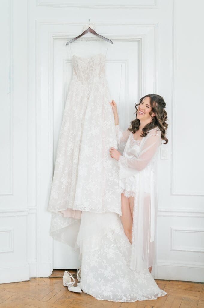 Miranda admiring her wedding gown at the Aldworth Manor. 