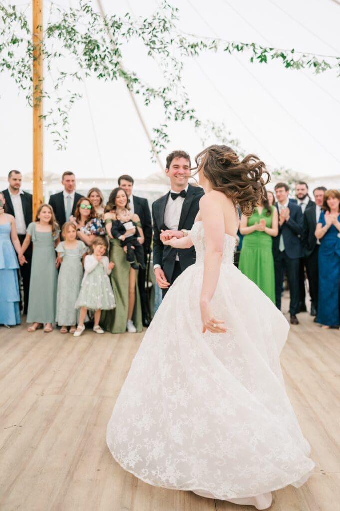 Mitch twirls miranda during their first dance. 