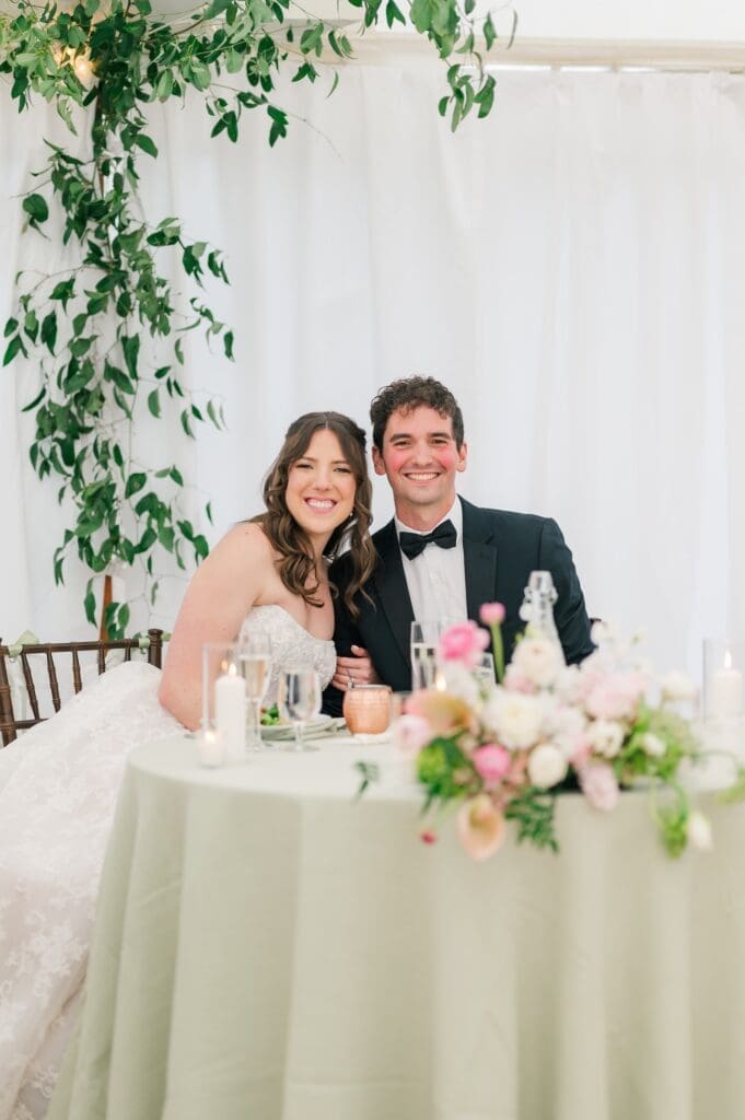 Mitch and Miranda sit at their sweetheart table. 