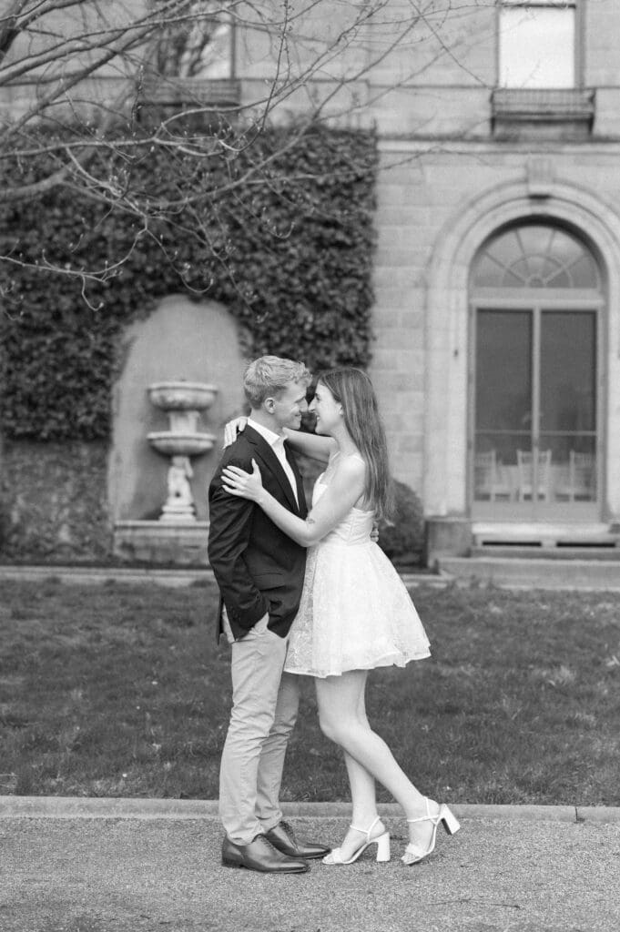 Sydney and Dylan touch noses and smile in the gardens at Harkness Memorial State Park. 