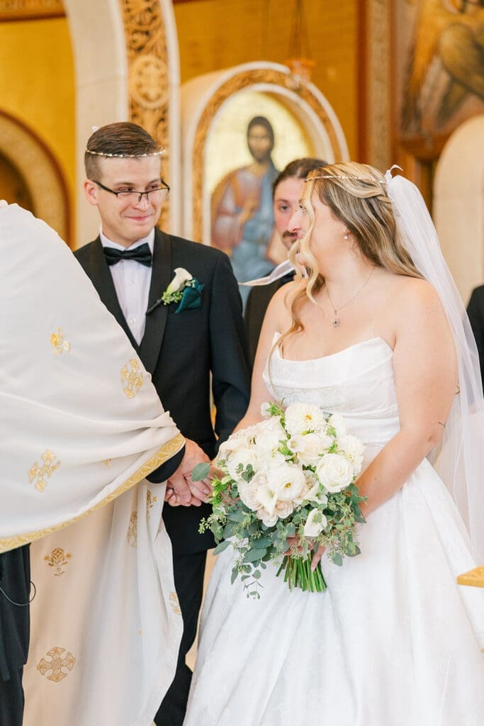 Trey smiles at Magdalene as they walk on the Altar. 