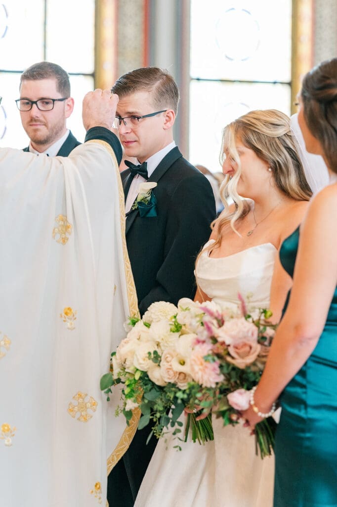 The rings are blessed for Magdalene and Trey. 
