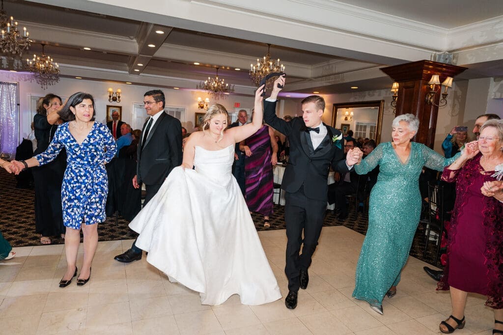 Magdalene and Trey dance together with their guests. 