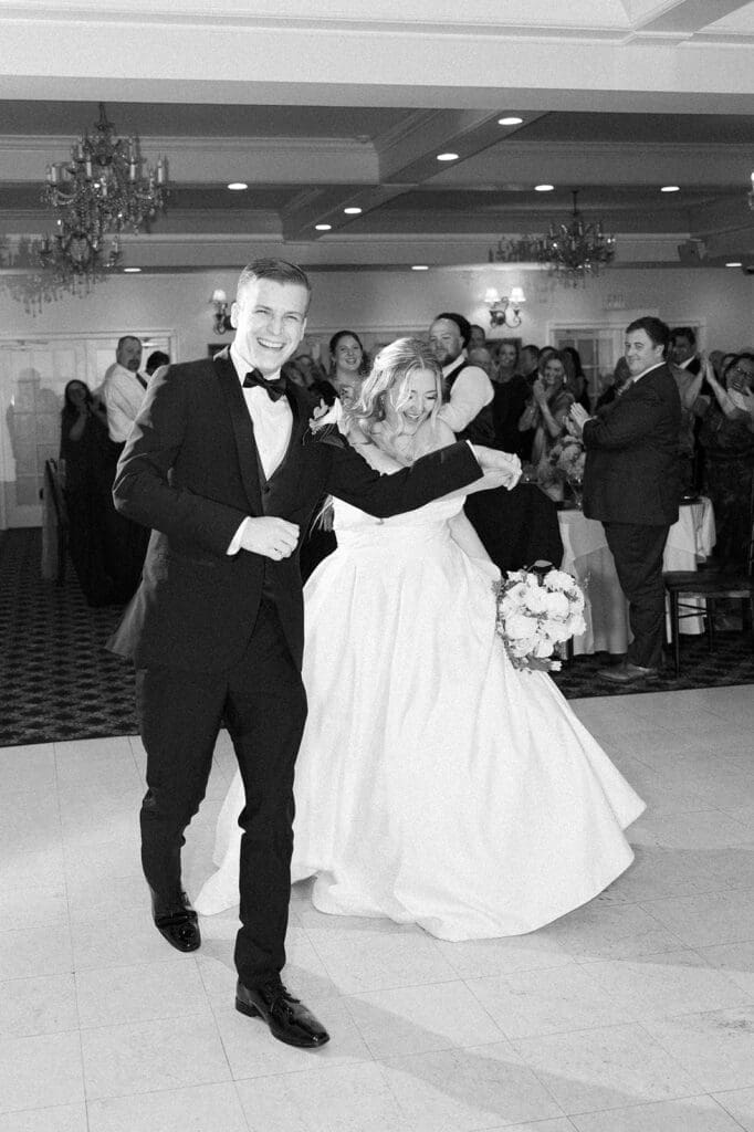 Magdalene and Trey enter their woodwinds wedding reception together. 