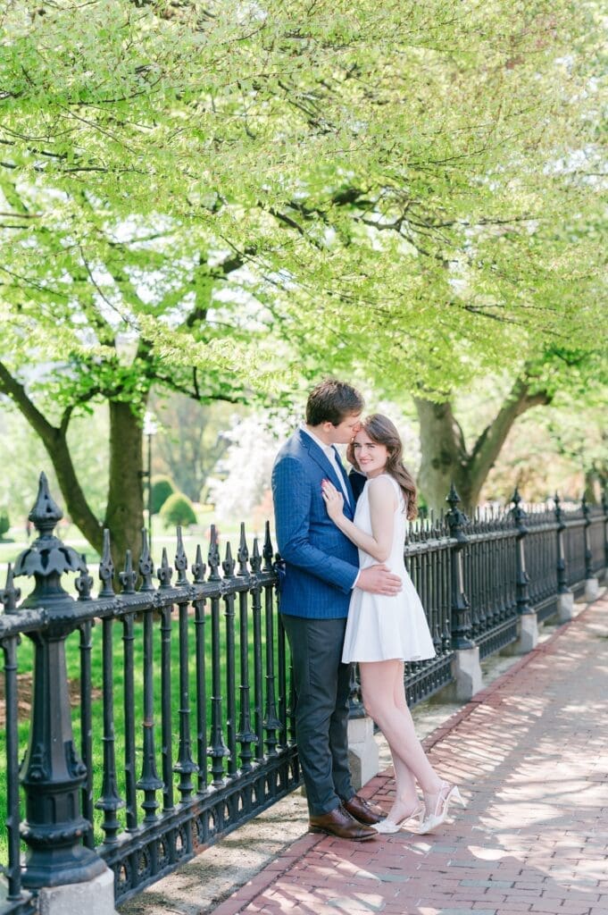 Julia leaning against Brandon outside the Boston public garden. 