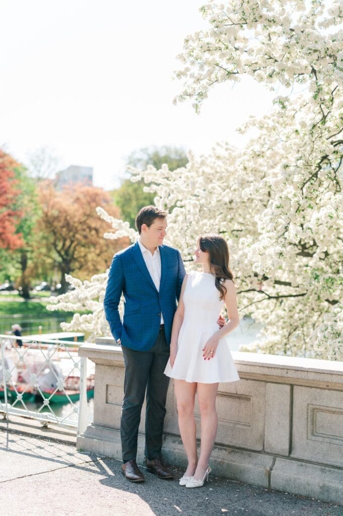 Brandon wrapping his arm around Julia's hip and smiling at her. 