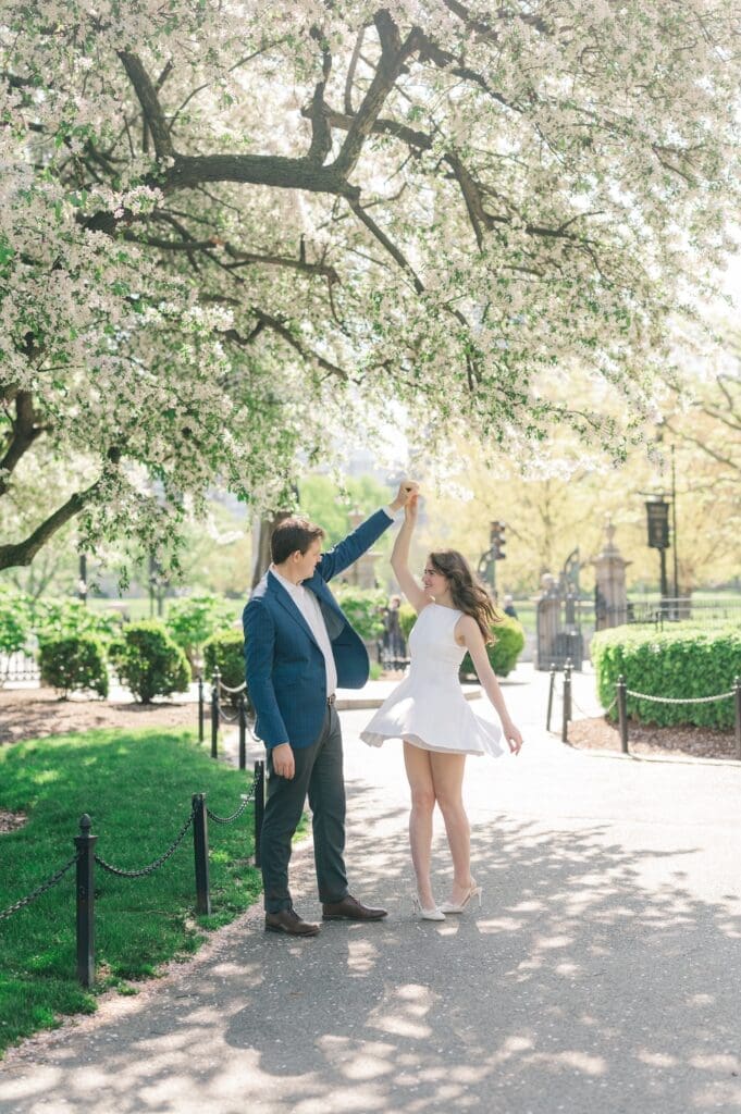Brandon twirls Julia inside the Boston Public Garden. 