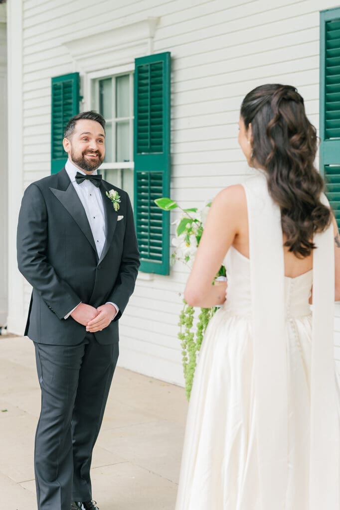 Tom turns around to see Natalie in her dress for the first time. 
