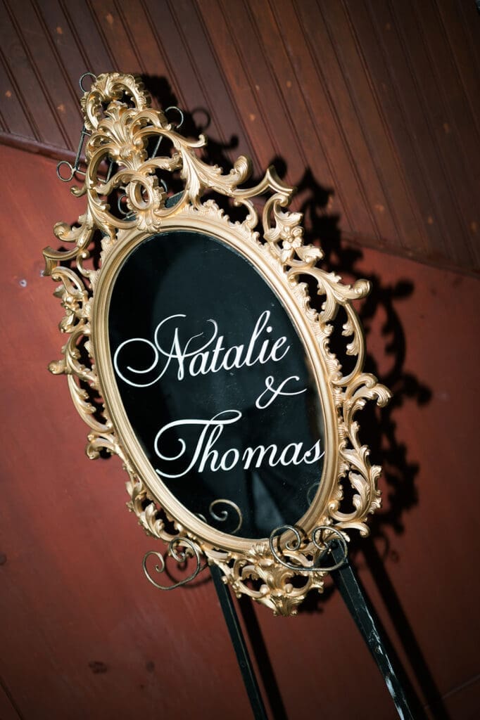 A mirror that says "Natalie and Thomas"