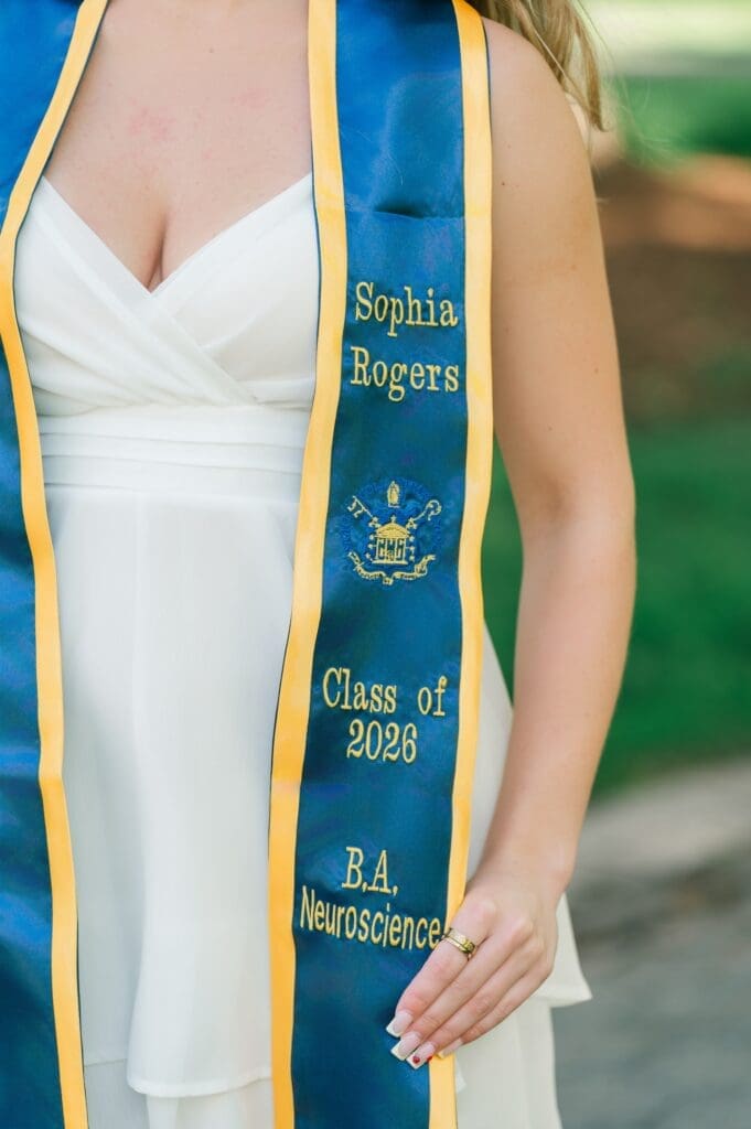 An up close photo of Sophia's stole that says "Sophia Rogers; Class of 2026; BA Neuroscience"