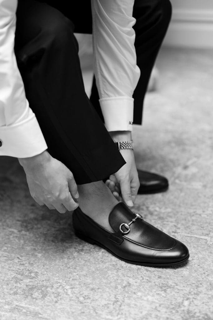 Sang fixes his shoes