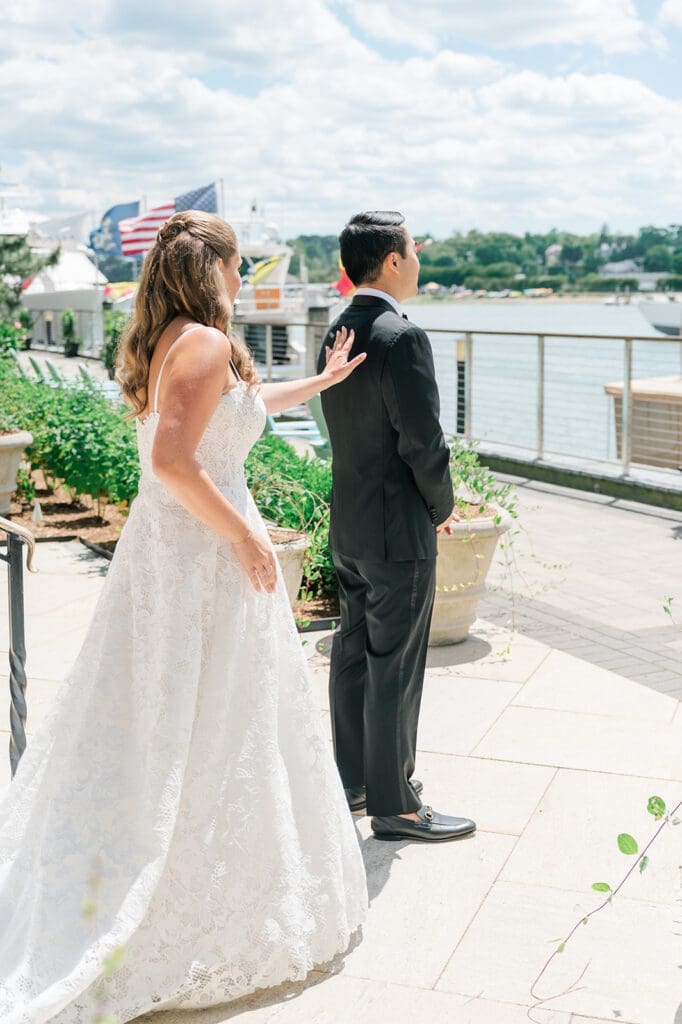 Katie taps Sang so he can turn around for their wedding first look at Delamar Greenwich.