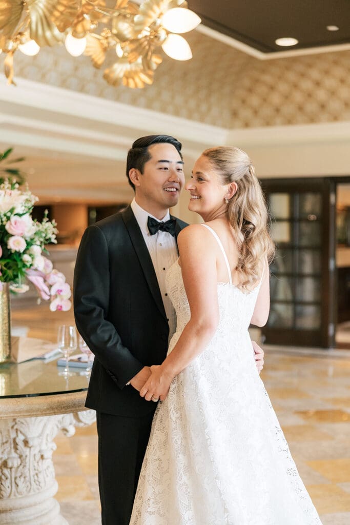 Sang smiles at Katie lovingly in the lobby of Delamar Greenwich Harbor Hotel. 