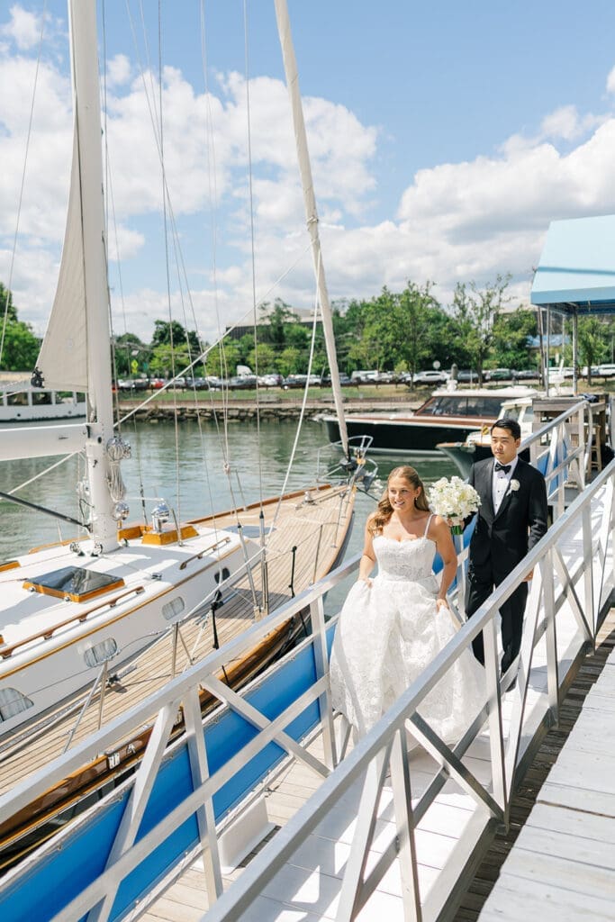 Katie and Sang walk down the dock at Delamar Greenwich.