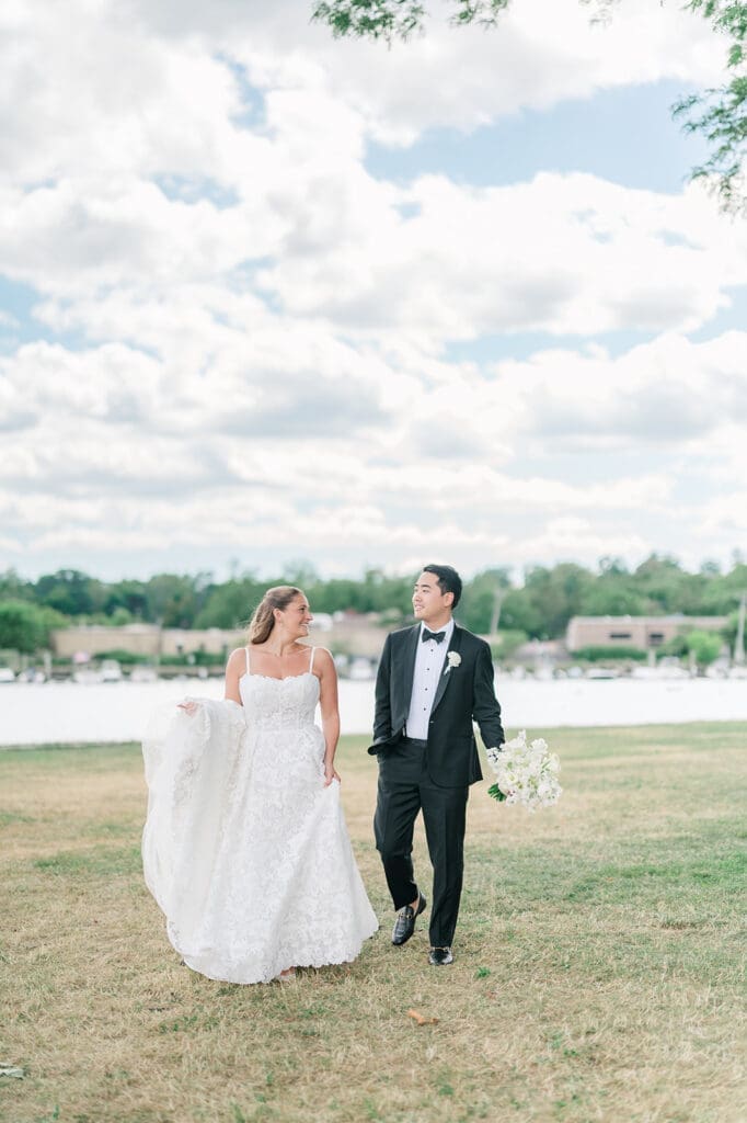 Sang and Katie walk together at Delamar Greenwich for wedding portraits. 