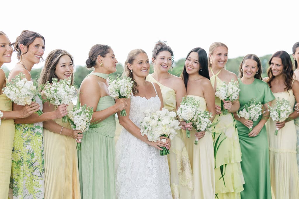 Katie and her bridesmaids laugh together