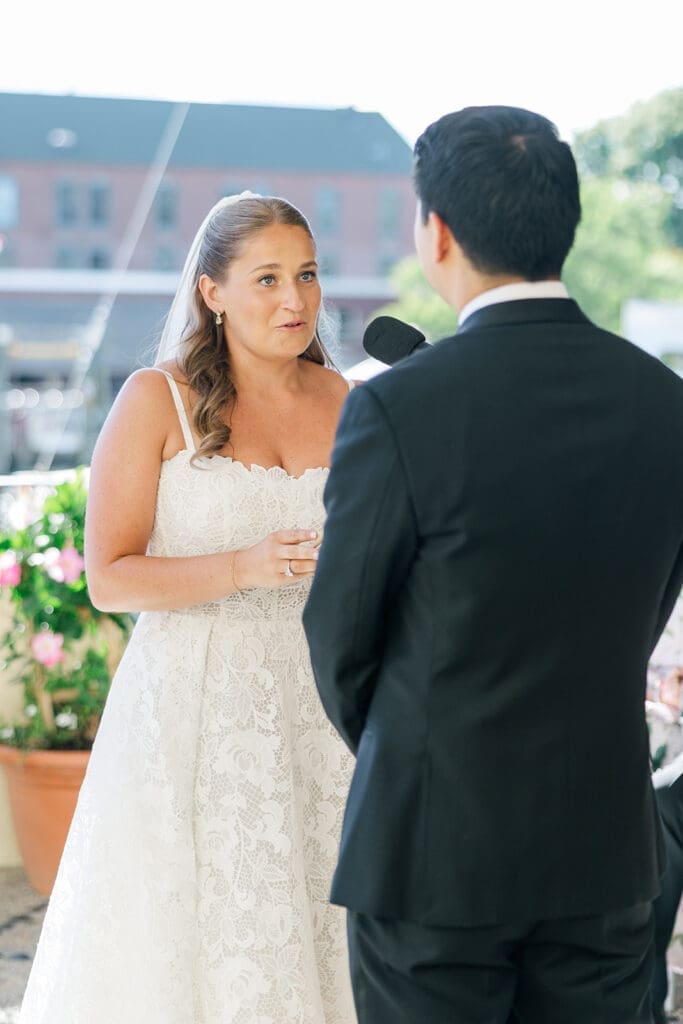 Katie reads her vows to Sang during their wedding ceremony. 