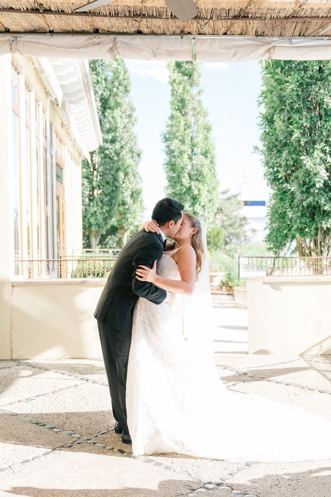 Sang and Katie share their first kiss at their wedding ceremony at Delamar Greenwich. 