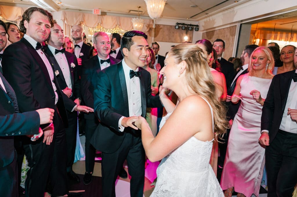 Katie and Sang dance with their wedding guests. 