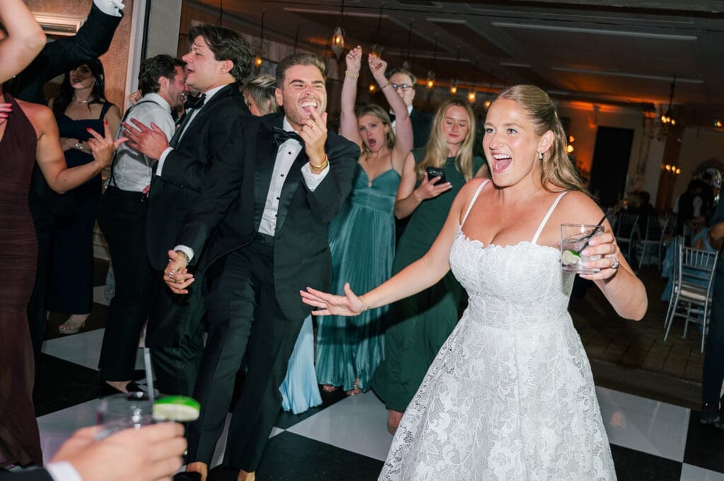 Katie enters the dance floor with a smile. 