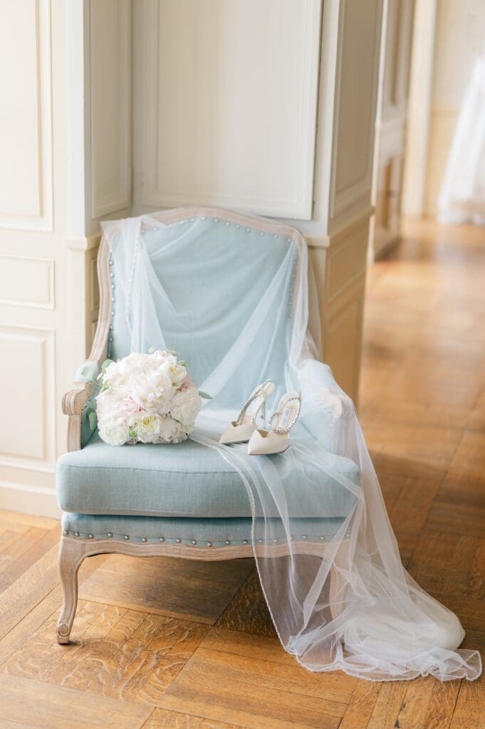 Jimmy Choos, a veil, and a bouquet on a chair at Glen Manor House wedding