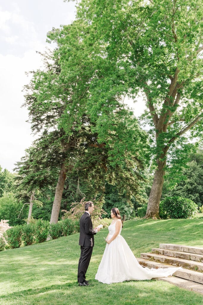 Chris reads his vows to Emily at their Glen Manor Wedding. 