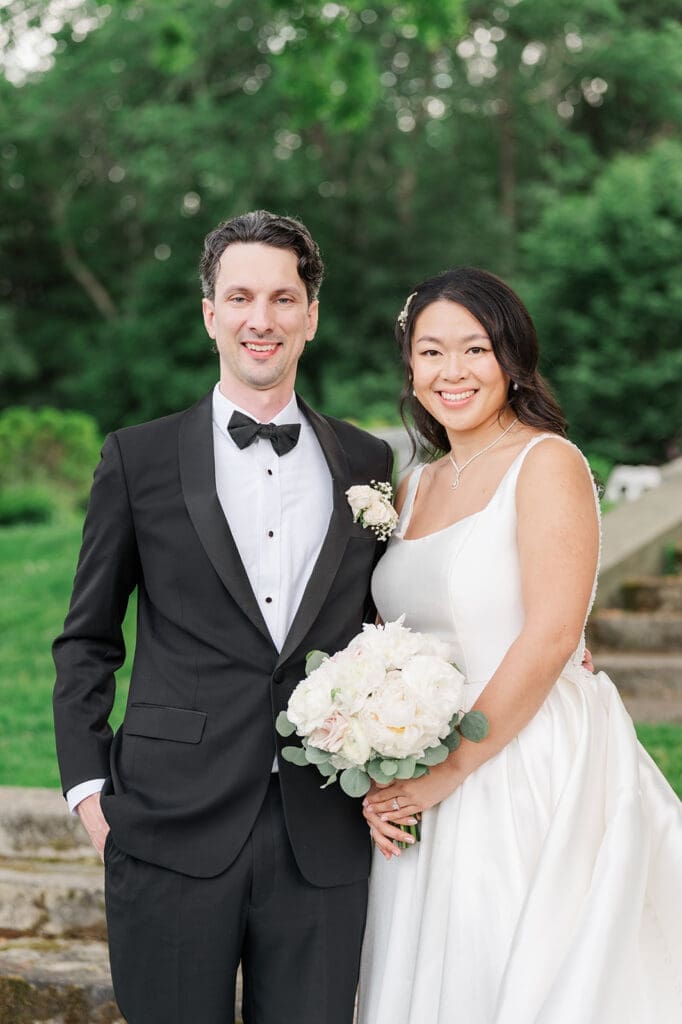 Emily and Chris smile for a classic portrait at their Glen Manor Wedding. 