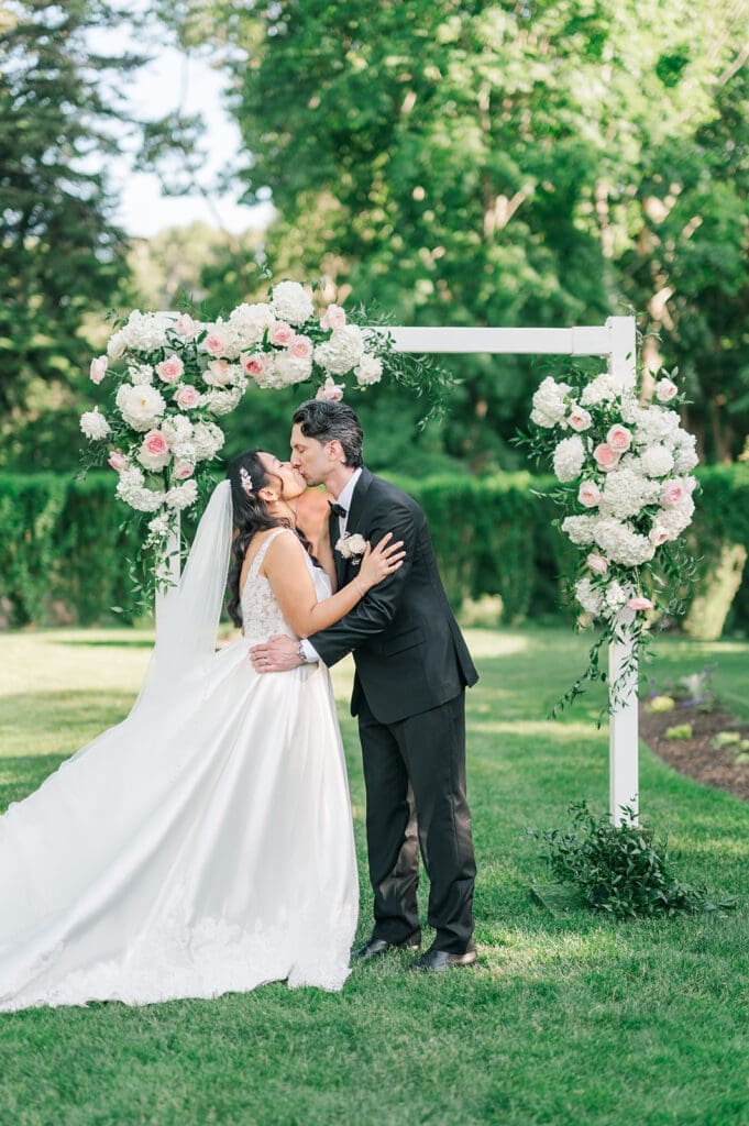 Chris and Emily kiss for the first time as husband and wife at their Glen Manor House wedding 