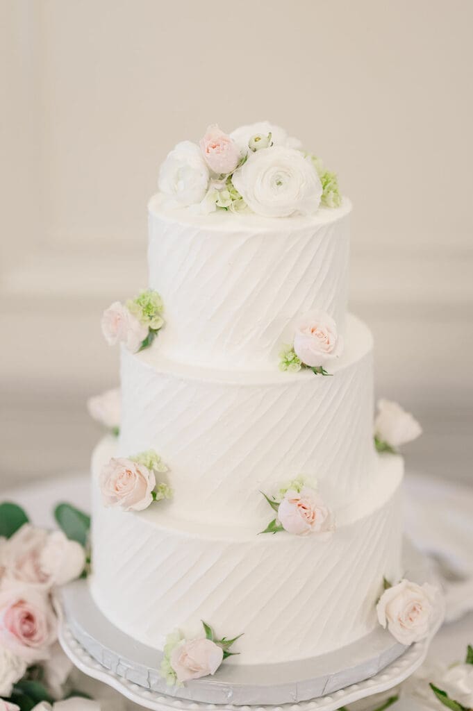 A three-tier wedding cake for Emily and Chris