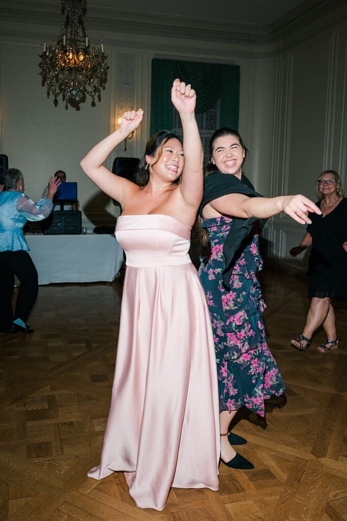 Two guests dance on the dance floor at the Glen Manor House wedding