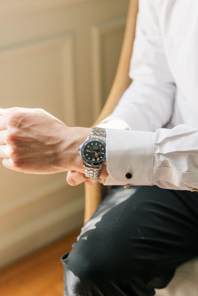 Chris adjusts the watch on his wrist, a gift from his father-in-law the day prior. 