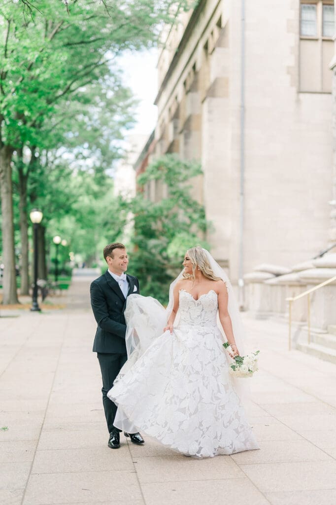 Jacquie and Thomas walk outside the church before heading to their Anthony's Ocean View wedding. 