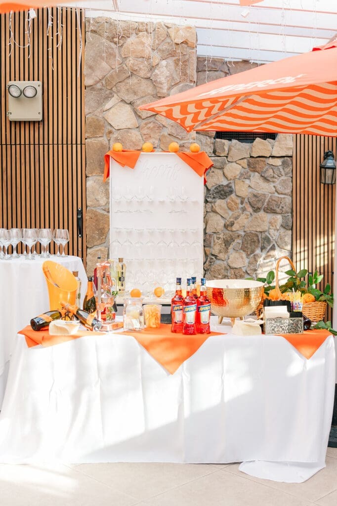 The side room at the Anthony's Ocean View wedding set up as an aperol spritz bar 