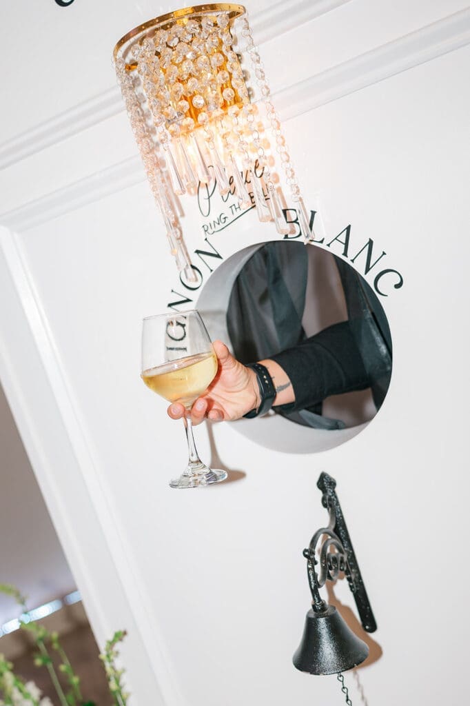 "Ring the bell" and someone hands you a glass of wine. 