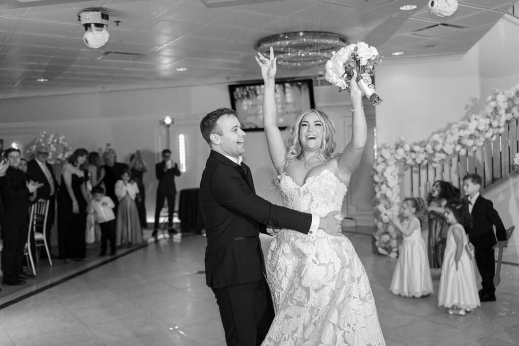 Jacquie and Thomas enter their wedding reception. 
