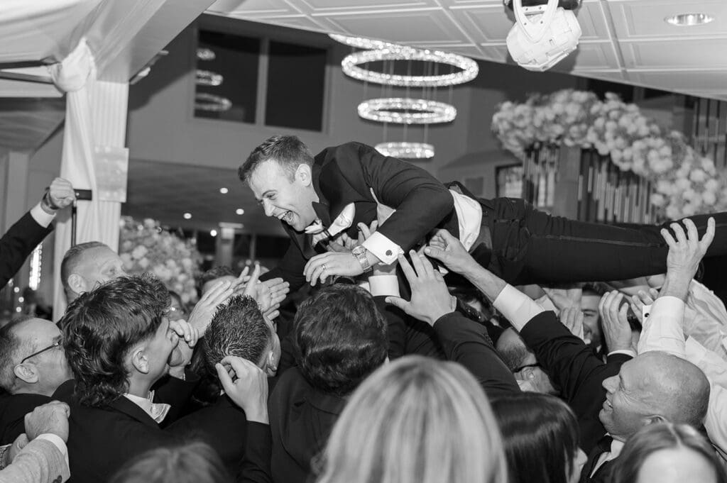 Thomas crowd surfs Anthony's Ocean View wedding. 