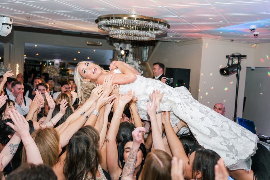 Jacquie crowd surfs Anthony's Ocean View wedding. 
