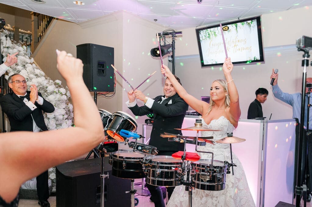 Jacquie and Thomas use the DJs drums during songs. 