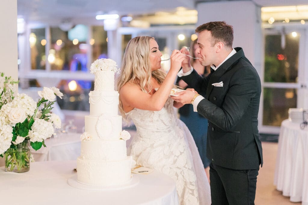 Jacquie and Thomas cut their 5-tier wedding cake at Anthony's Ocean View. 