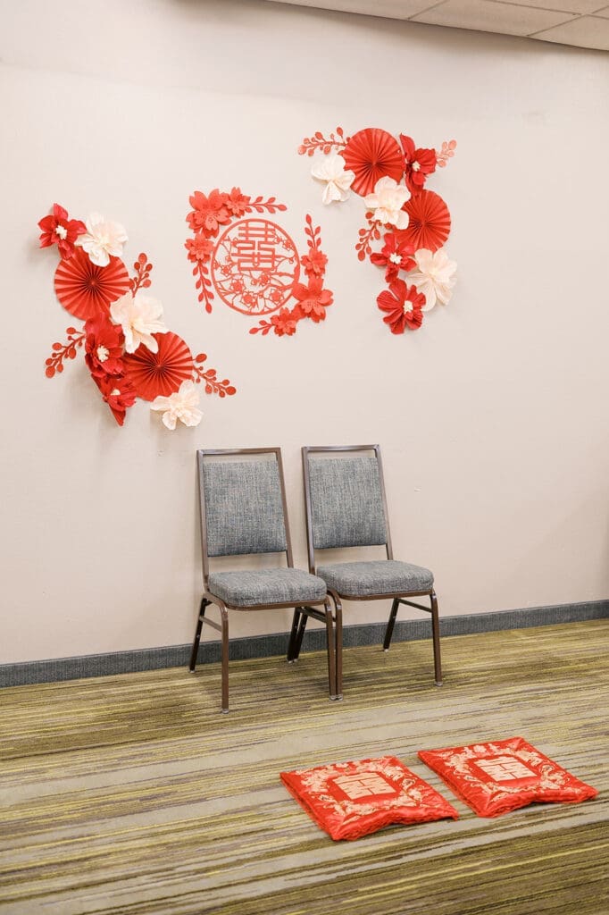 A chinese tea ceremony setup with chairs and decor