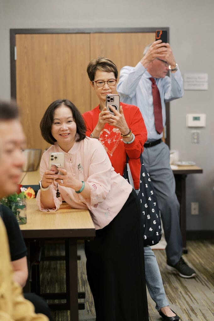 Family members taking photos at the chinese tea cermeony