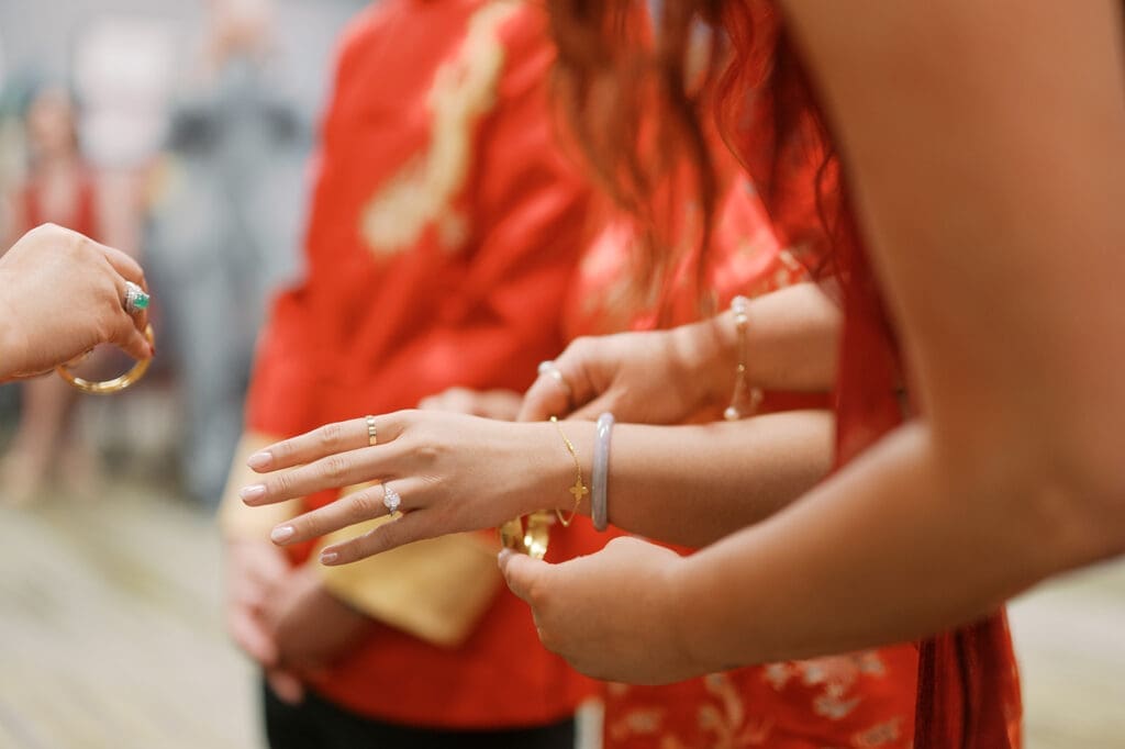 Jewelry is place don the bride's wrist