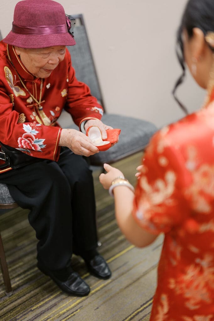 The bride's grandmother gifts them gold coins