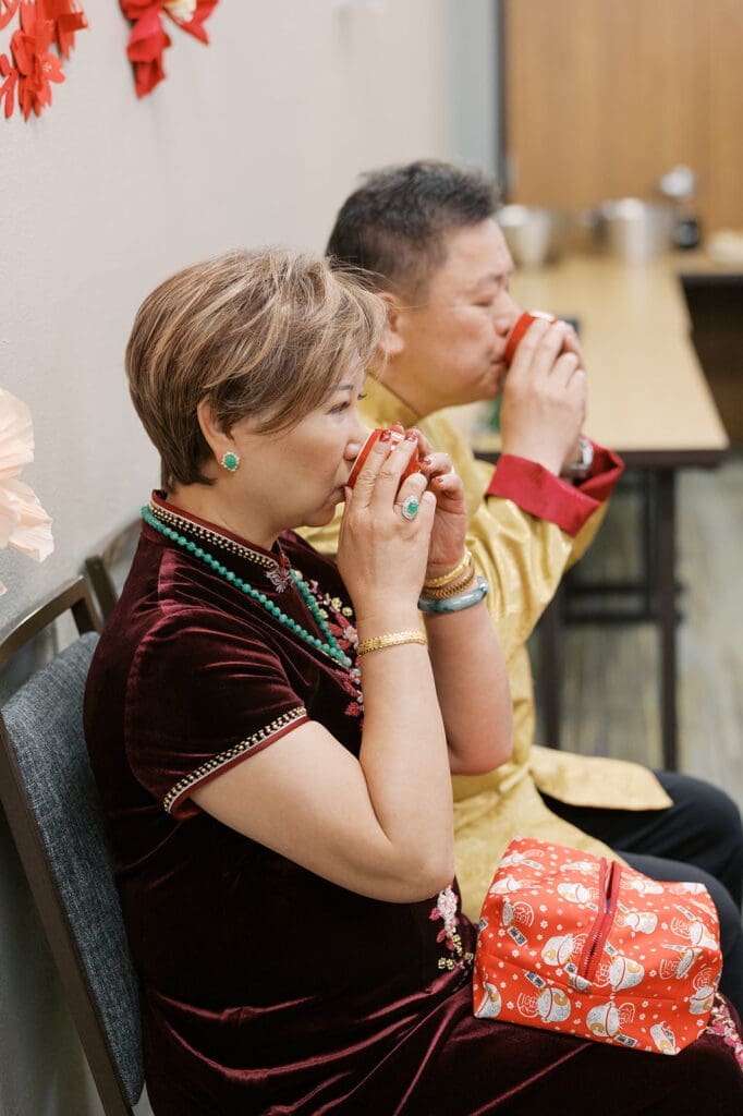 The bride's parents drink tea together